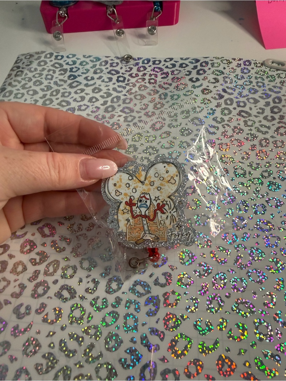 Disney Forky Glitter Badge Reel – Silver, White and Red Accent